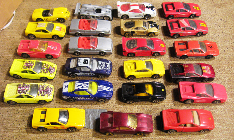 Three Cadillacs hiding amongst the Ferraris...